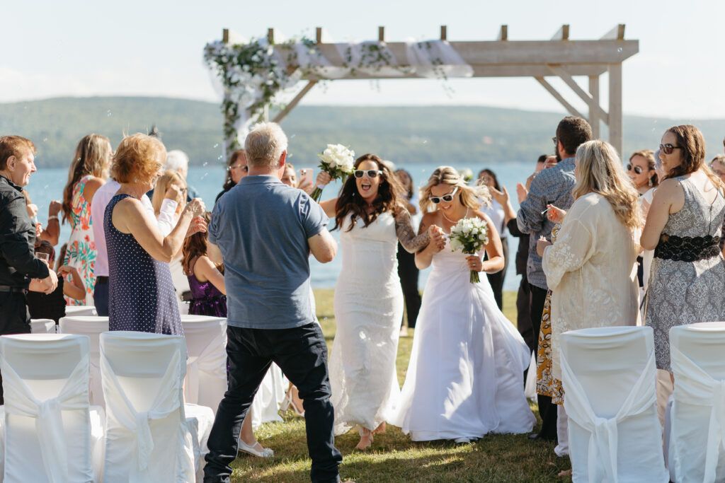 brides celebrating during recessional