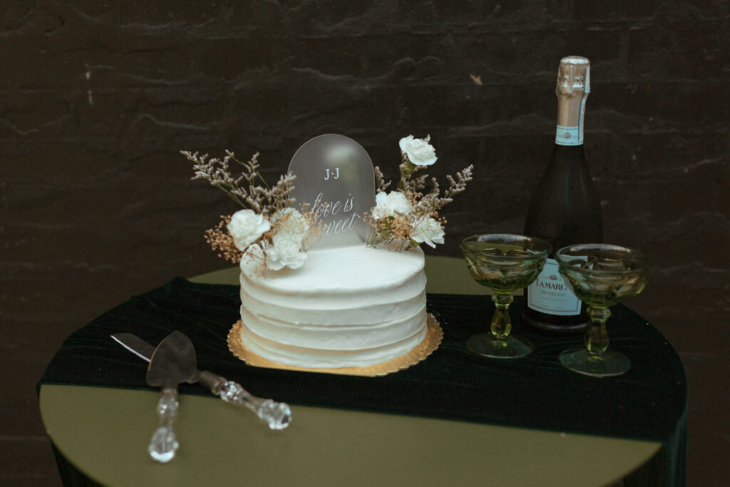 wedding cake with champagne and cocktail glasses