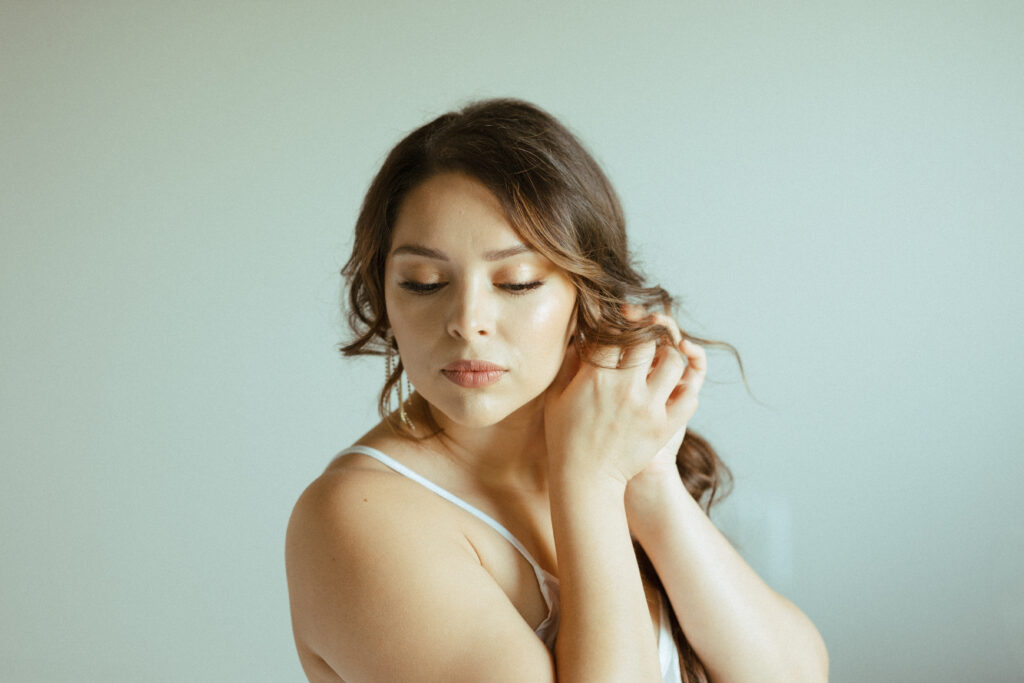 elegant bride getting hair and makeup