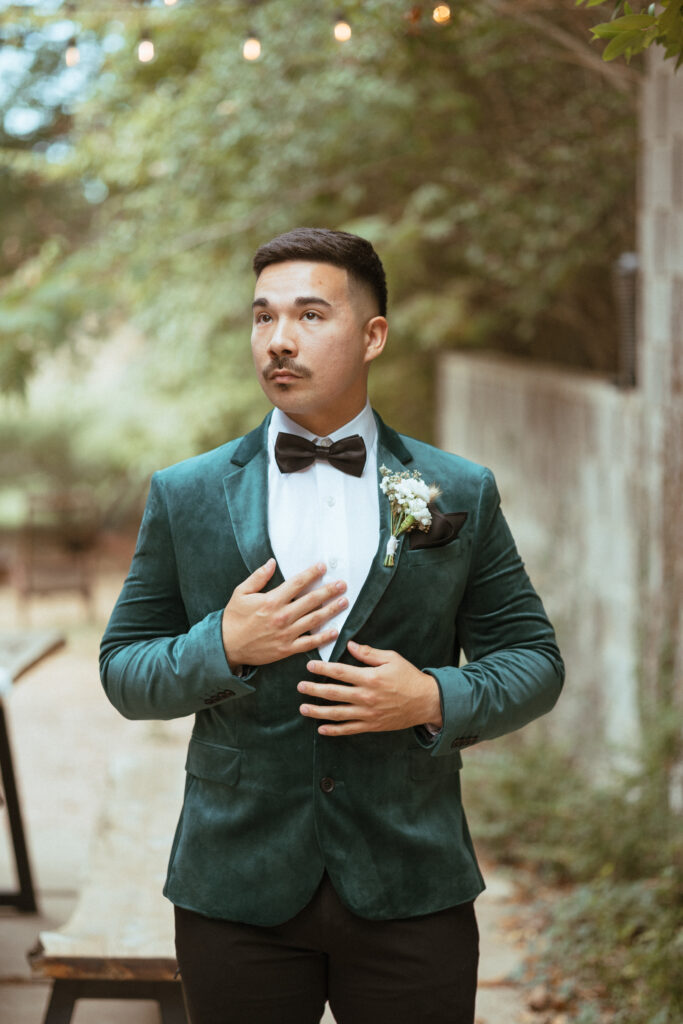groom wearing an emerald suit
