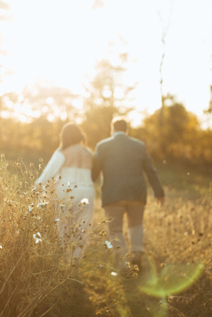 newlyweds frolicking through meadows in Nova Scotia's country