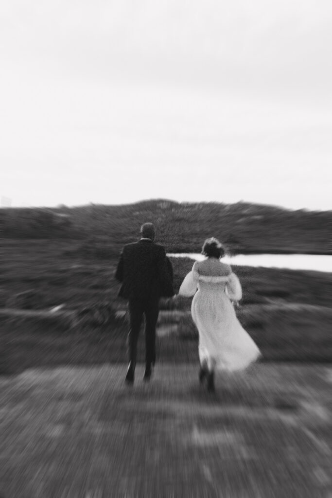 timeless editorial couple walking into the sunset in Halifax