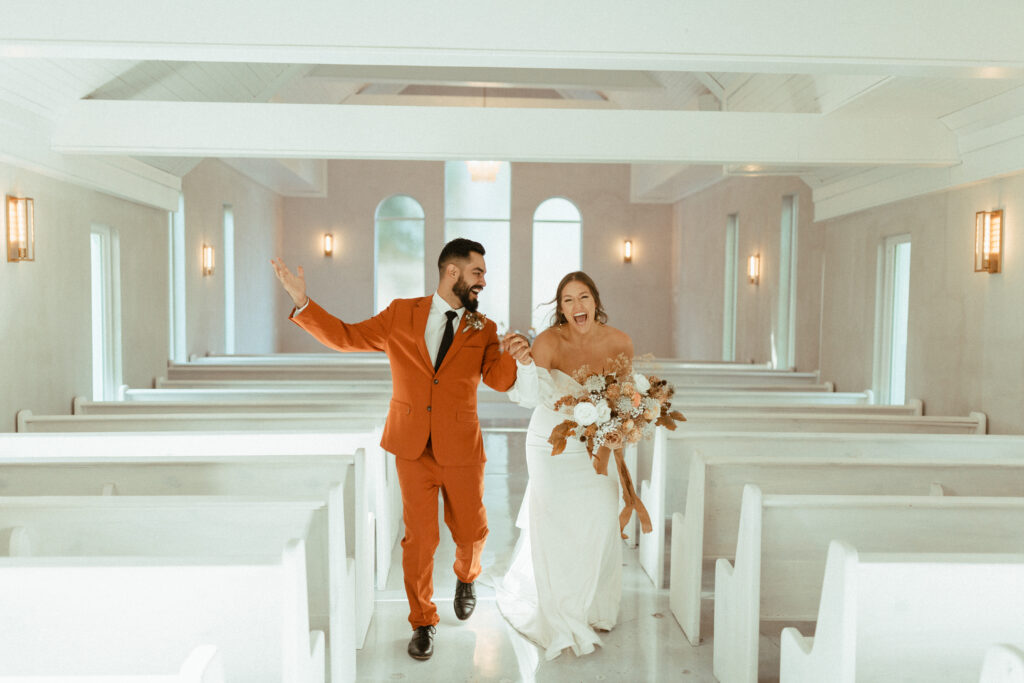 bride and groom during recessional 