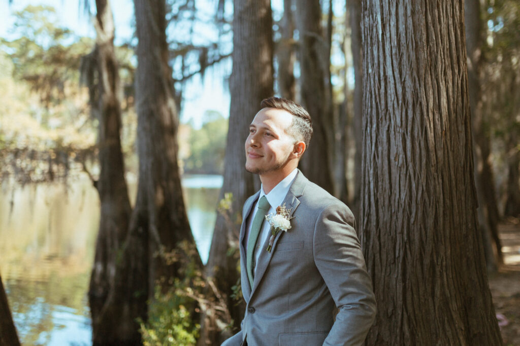 groom in his JC Penney suit in the forest