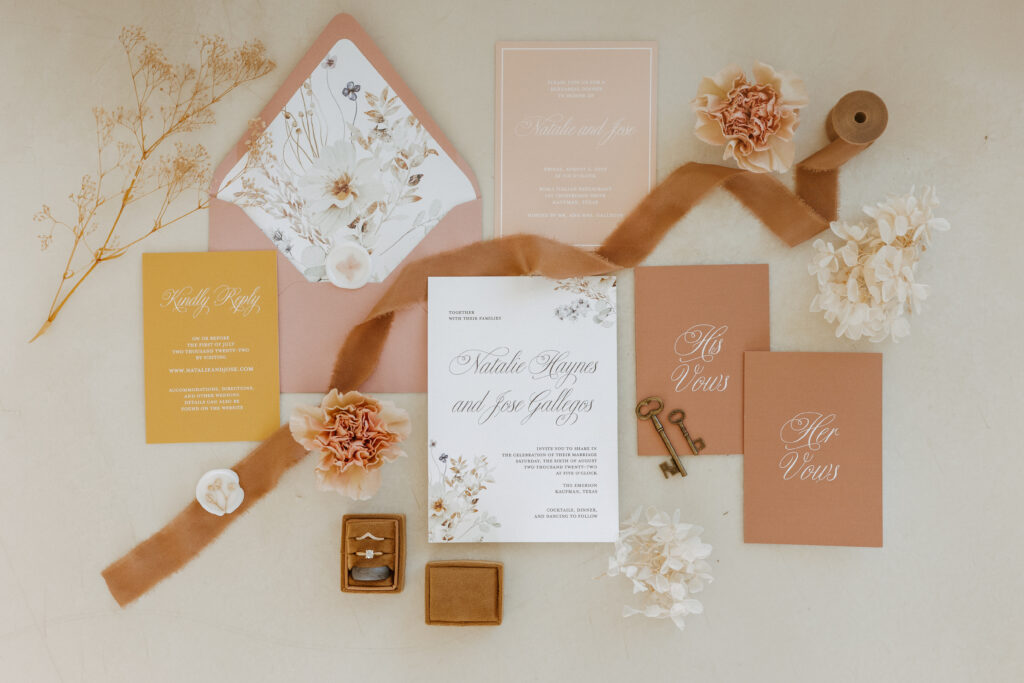 fall wedding flatlay with wedding invitations