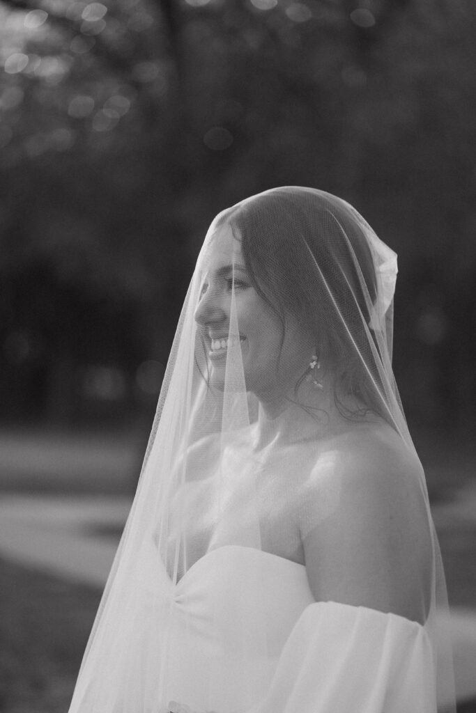 beautiful bride covered in her veil portrait