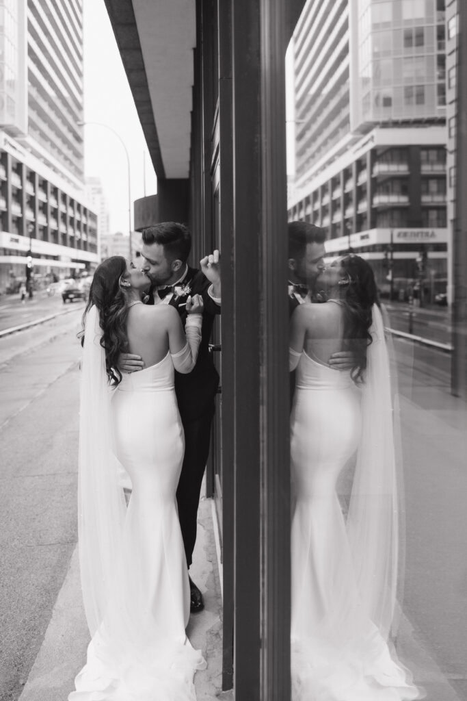 Bride and groom portraits on rainy day in downtown Halifax infront of The Halifax Club