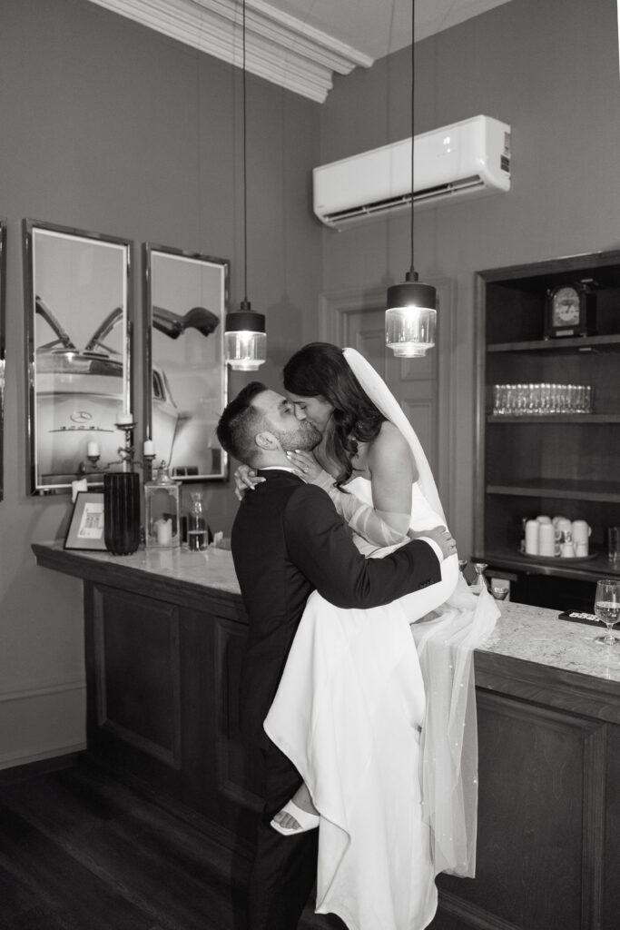 Bride and groom on the bar in the Halifax Club