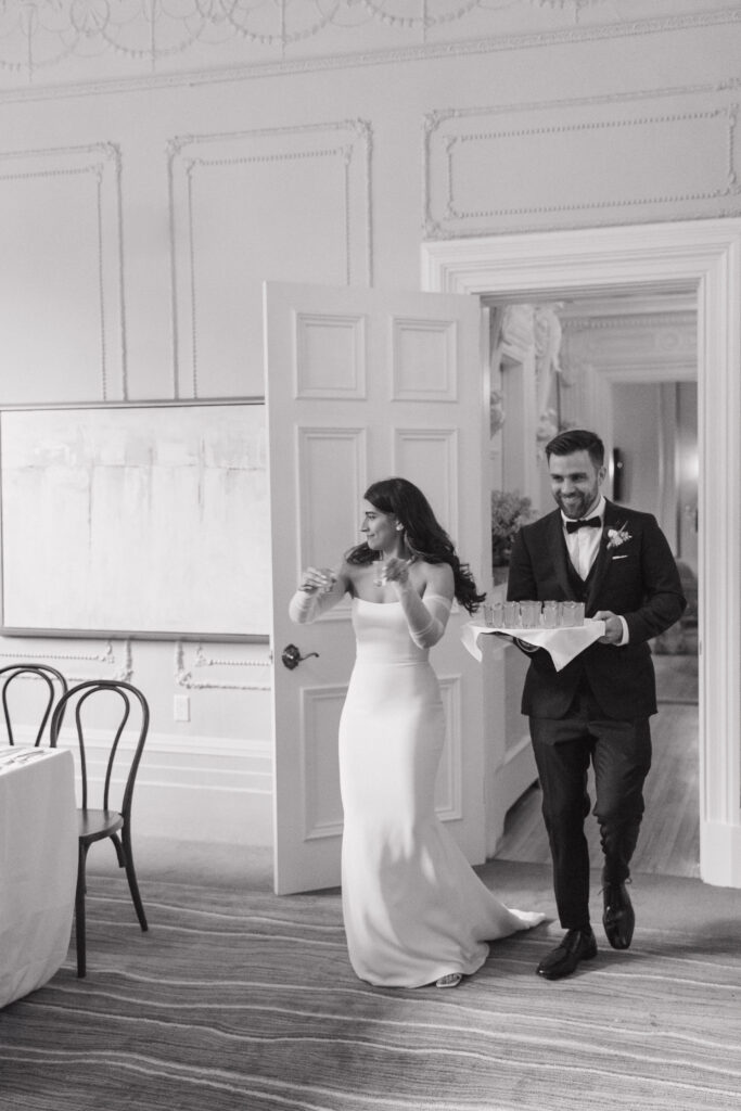 Bride and groom during dinner in the dining room at The Halifax Club