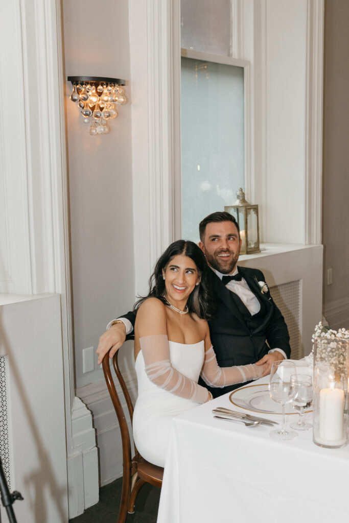 Bride and groom during speeches in the dining room at The Halifax Club