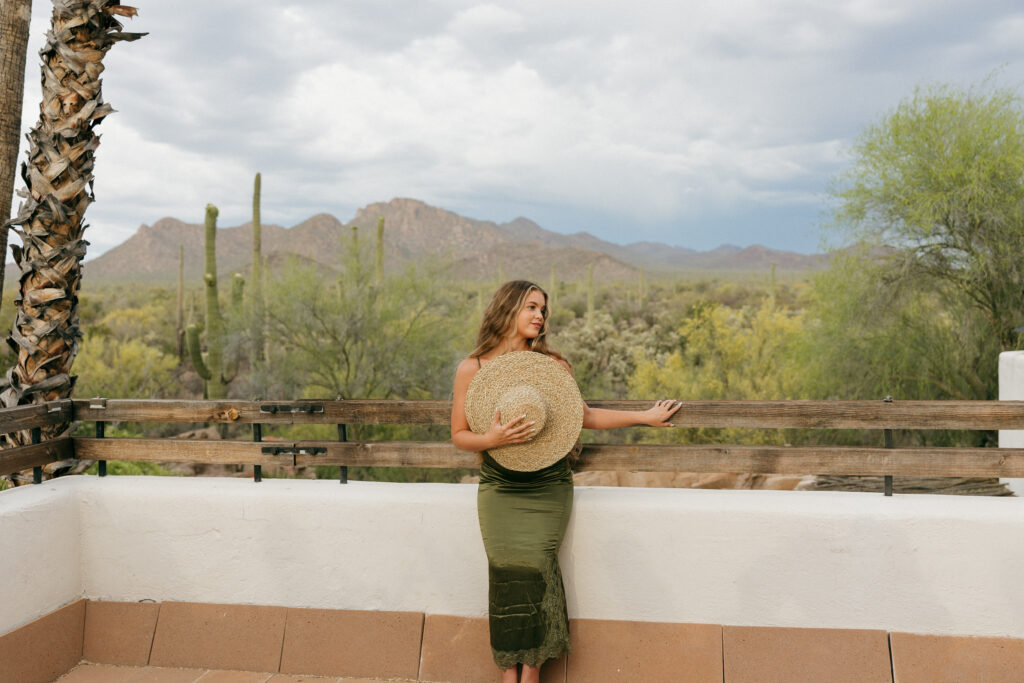 Editorial branding photoshoot of female in silk green dress amongst the desert in Saguaro National Park, at the Joshua Tree House in Tucson, Arizona / Wedding and Elopement Photographer